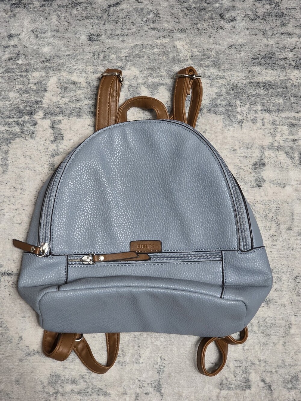 Roots Light Blue Pebbled Mini Backpack with Tan Straps